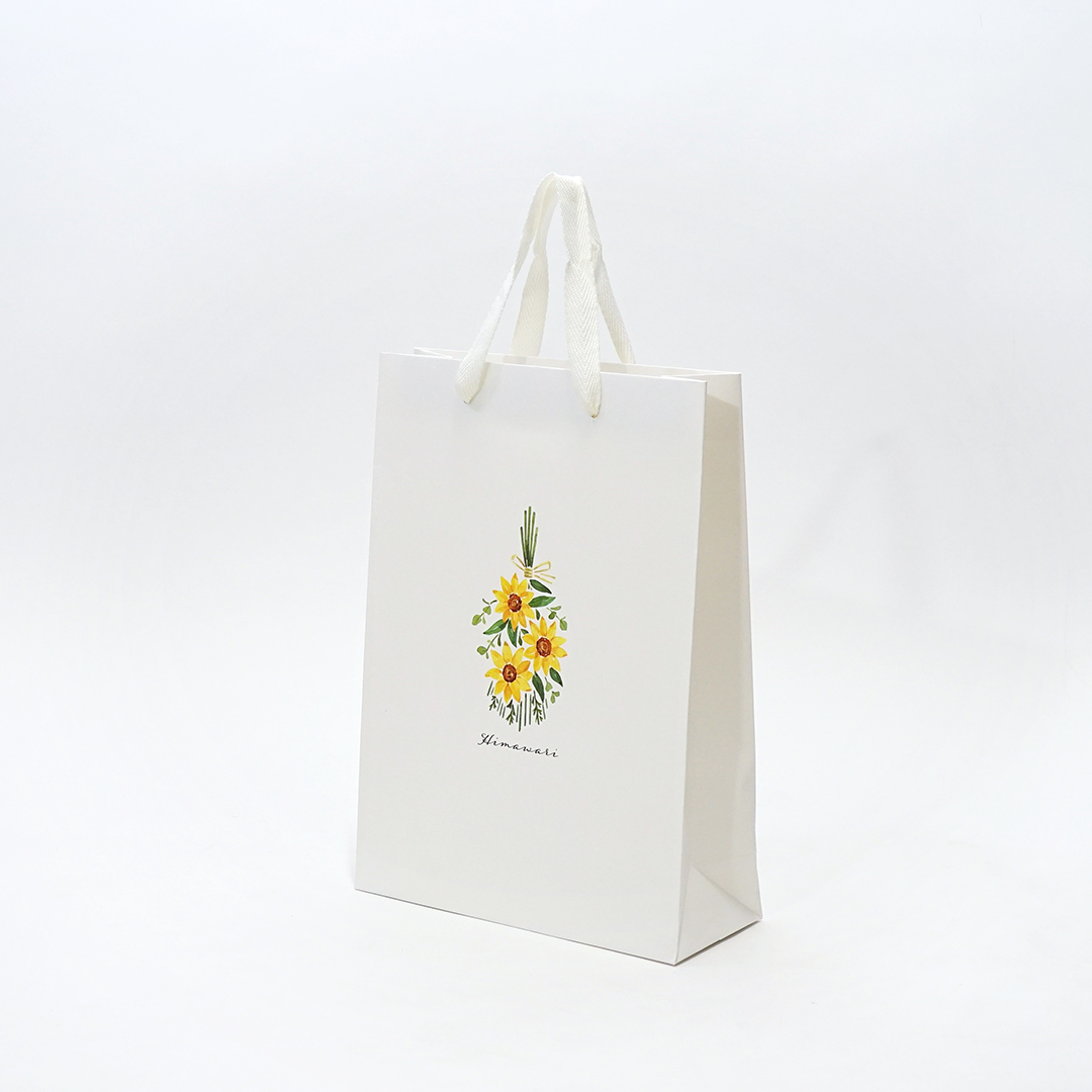 ひまわりの花が印刷された優しげな雰囲気の工務店の紙袋1